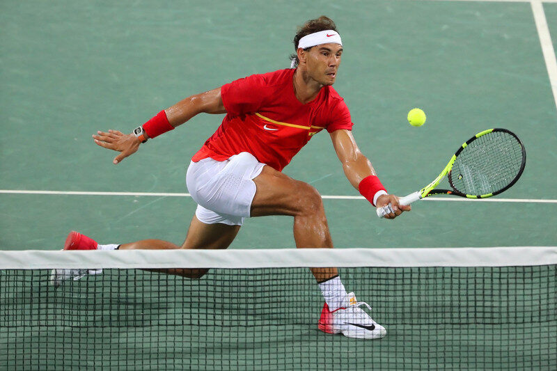 Nadal in a tennis match Nadal in a tennis match