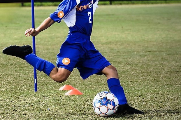 Kid playing soccer